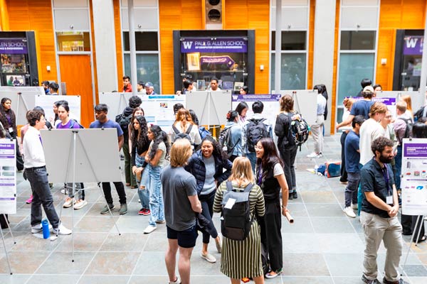 Undergraduate research students gather in the Allen Center for the annual Research Symposium