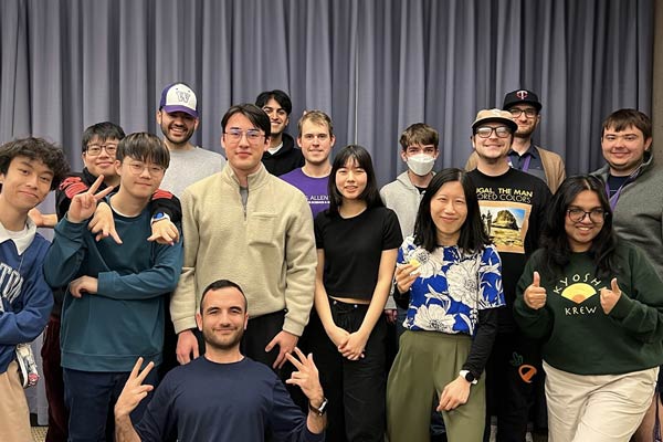 Large group of transfer students post for a group photo